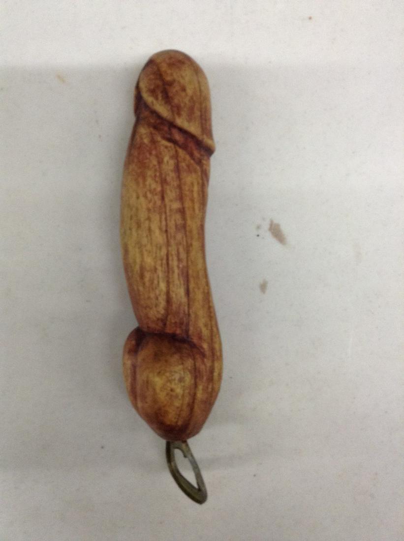 Wood carved phallic bottle opener: Wood carved phallic bottle opener
