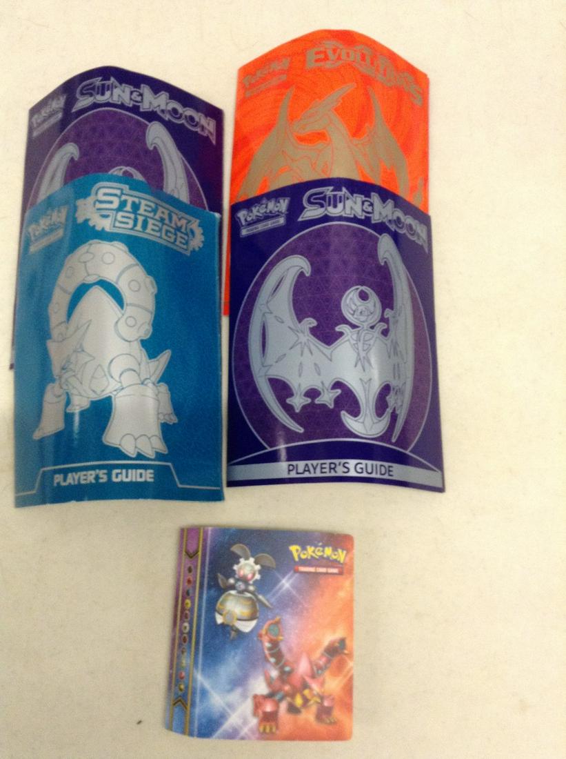 Four Pokemon Player's Guides and Card Holder (1 of 1)