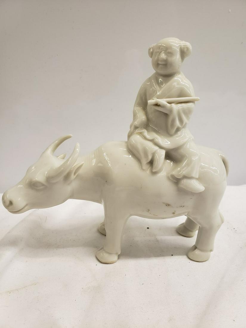 Porcelain Asian mad riding bull statue: Porcelain Asian mad riding bull statue