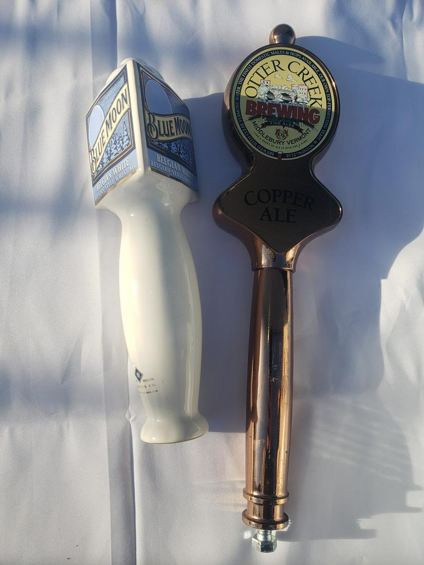 Two beer taps - Blue Moon and Otter Creek: Two beer taps - Blue Moon and Otter Creek