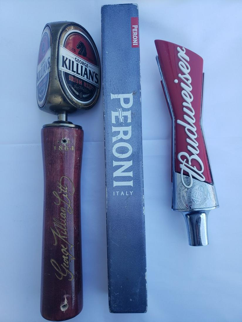 Three beer taps - Killians, Peroni, and budweiser: Three beer taps - Killians, Peroni, and Budweiser