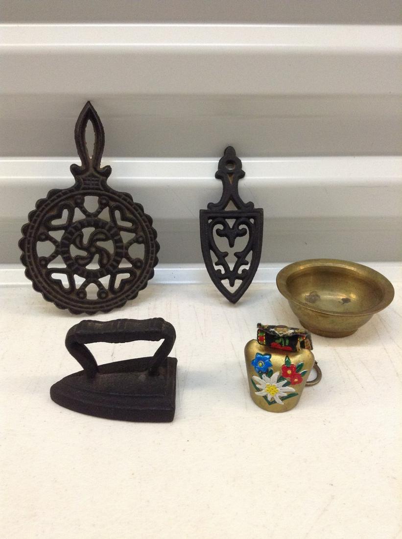 Lot of miniature cast iron trivets and more: Lot of miniature cast iron trivets and more