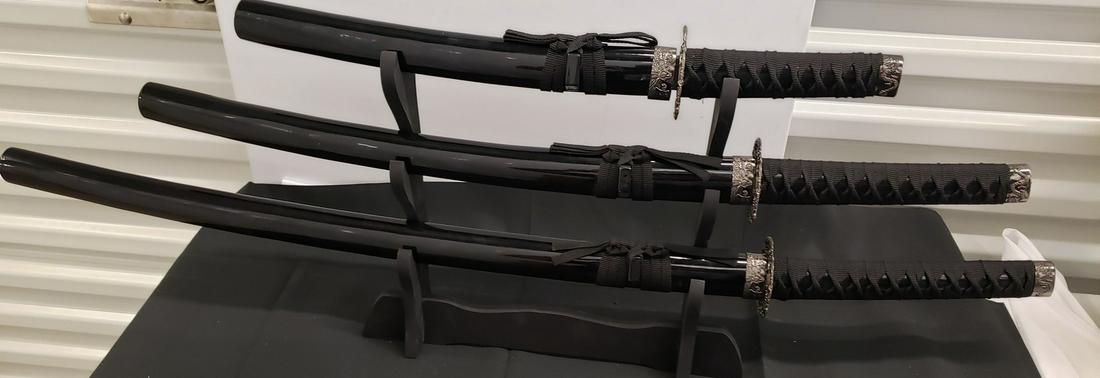 Lot of 3 swords with stand (1 of 1)