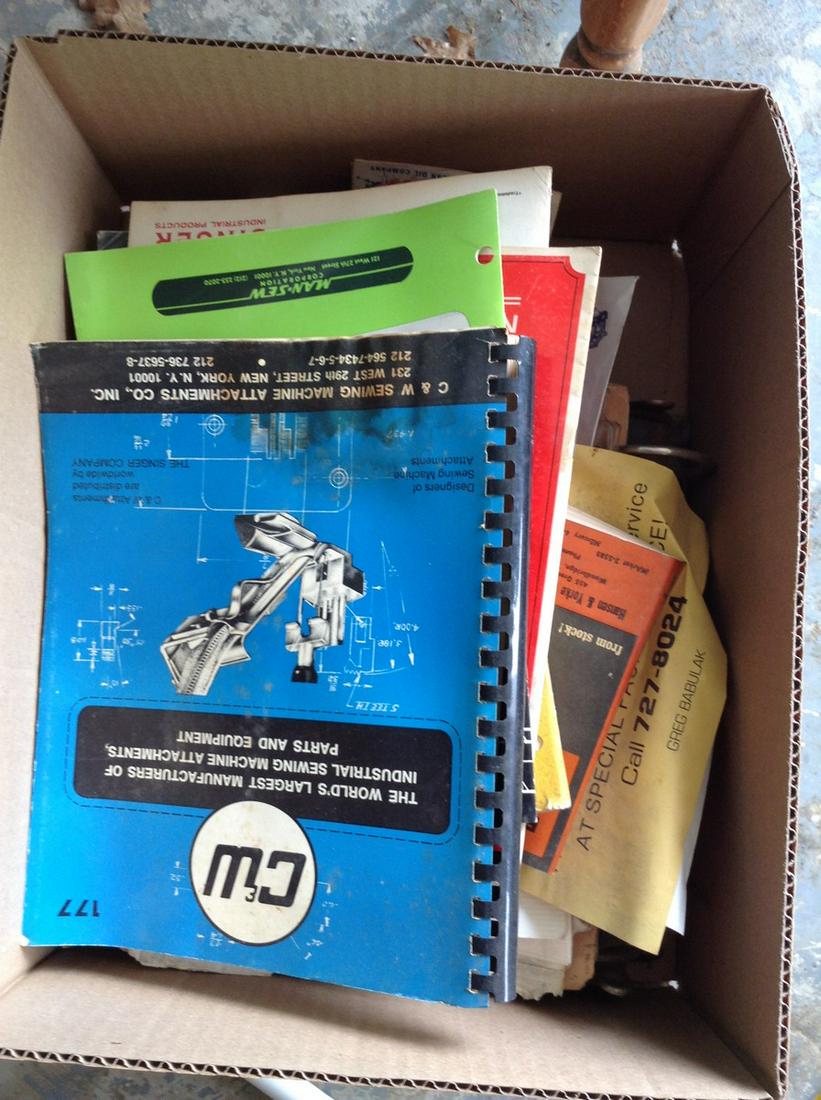 Box full of vintage sewing machine manuals (1 of 1)