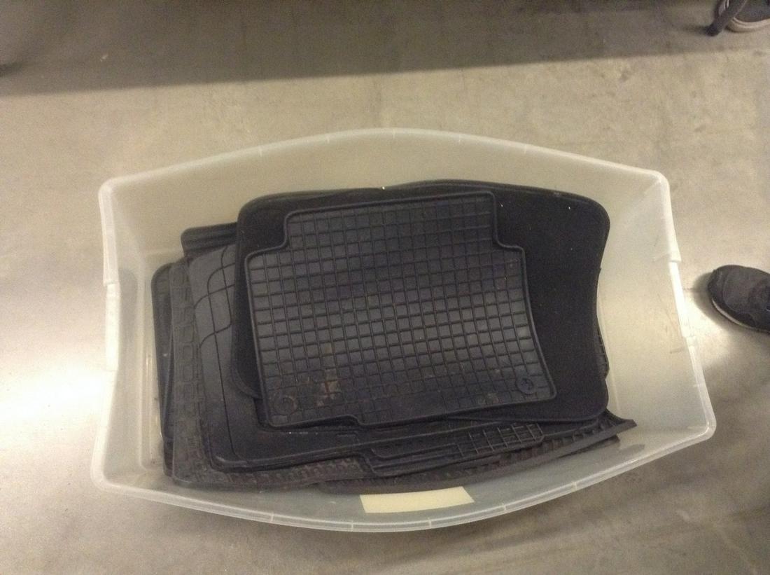 bin full of various car floor mats: bin full of various car floor mats