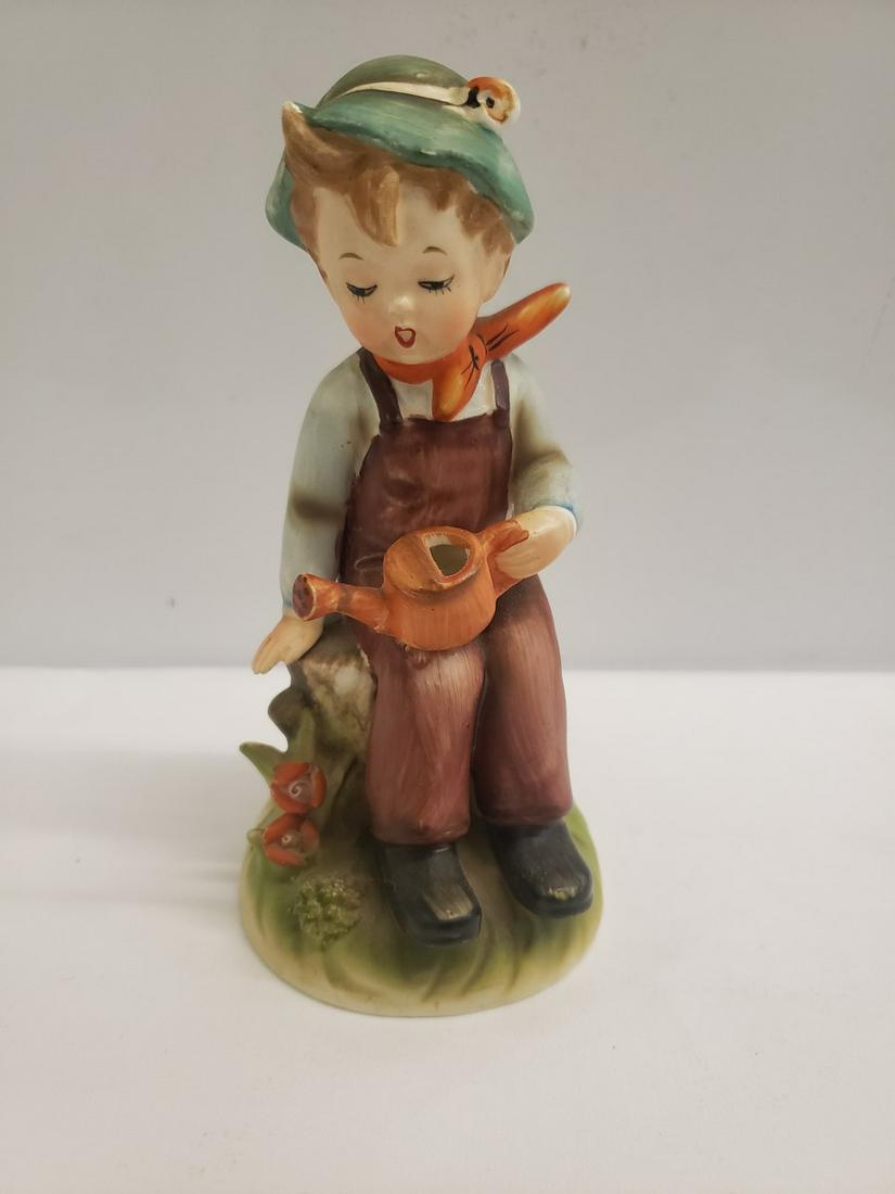 Hummel boy watering grass statue: Hummel boy watering grass statue