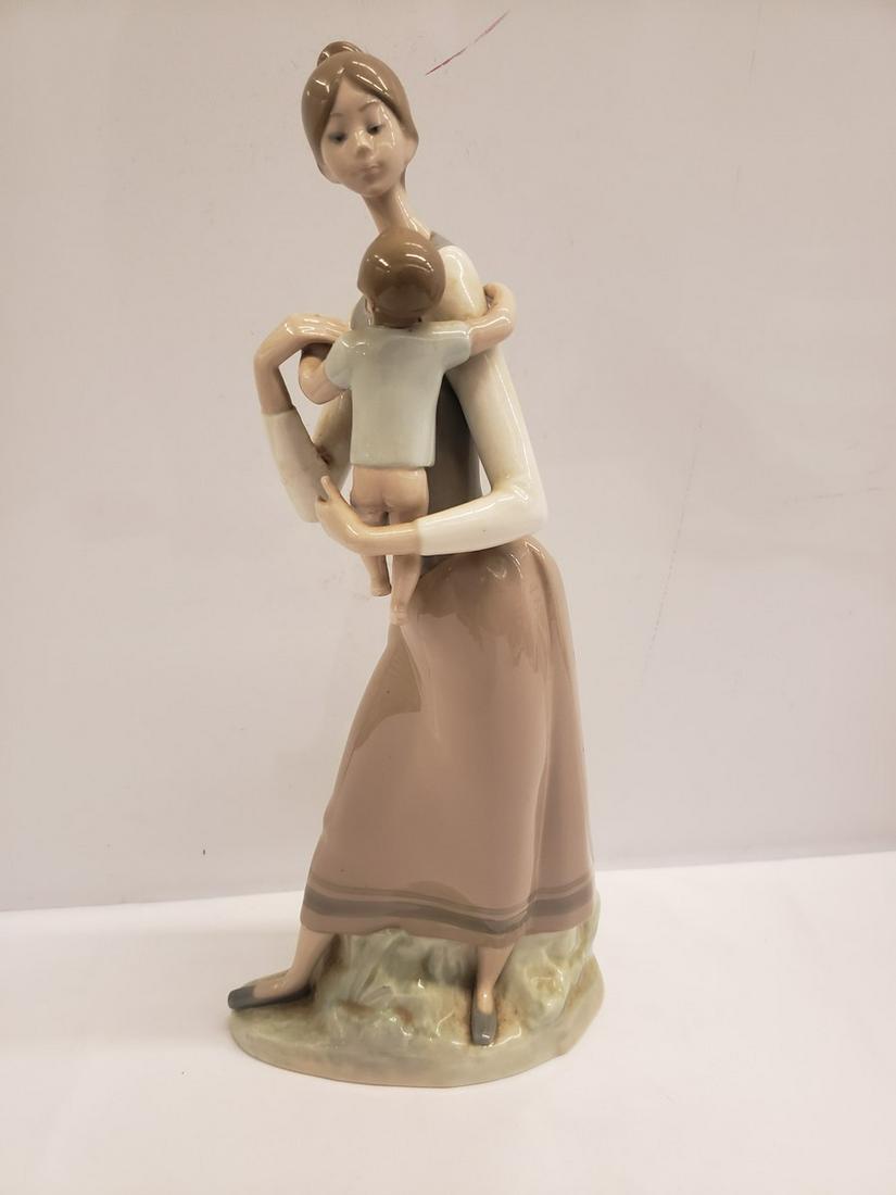 Lladro statue woman holding boy - approx. 15" tall. (1 of 1)