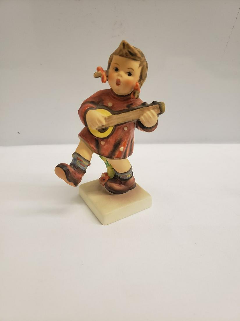 Hummel girl playing banjo statue: Hummel girl playing banjo statue