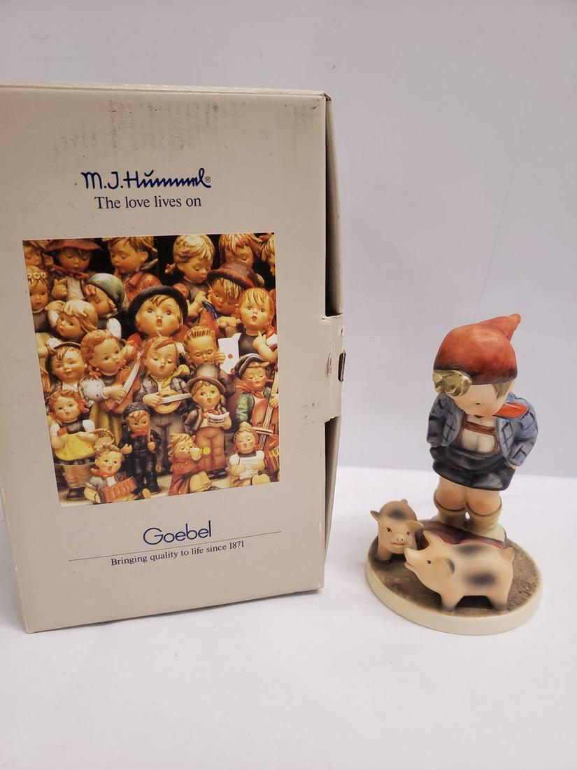 Hummel boy with pigs new in box: Hummel boy with pigs new in box