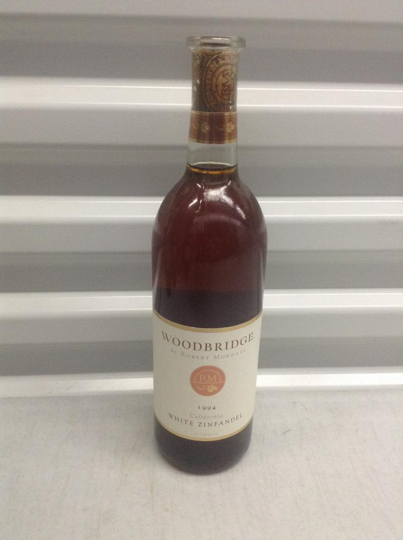 1994 Woodbridge Robert Mondavi White Zinfandel: Any contents in bottle is Free; You are bidding on the bottle & unbroken tax stamp