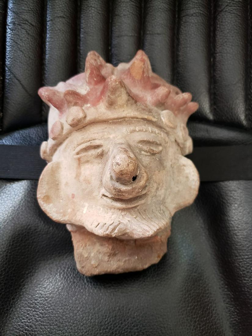 Pre-Columbian Clay artifact mans face with a ring in (1 of 1)