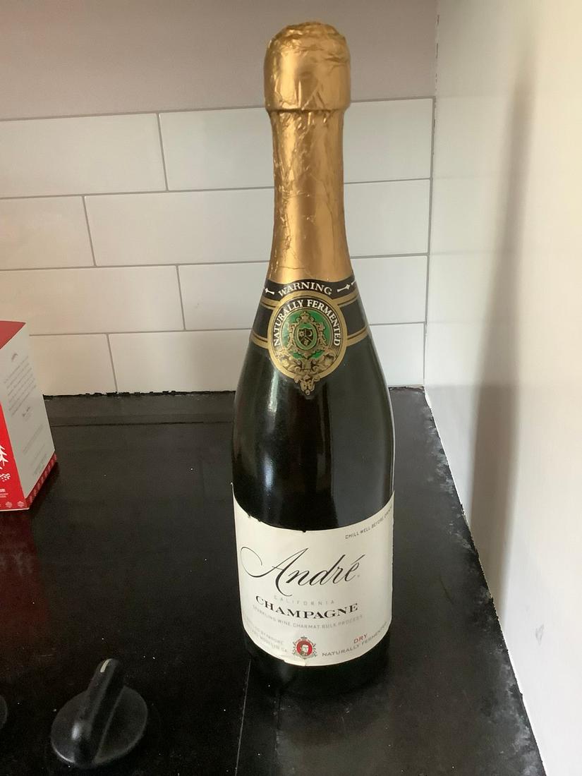 Andre Dry Champagne: Any contents in bottle is Free; You are bidding on the bottle & unbroken tax stamp