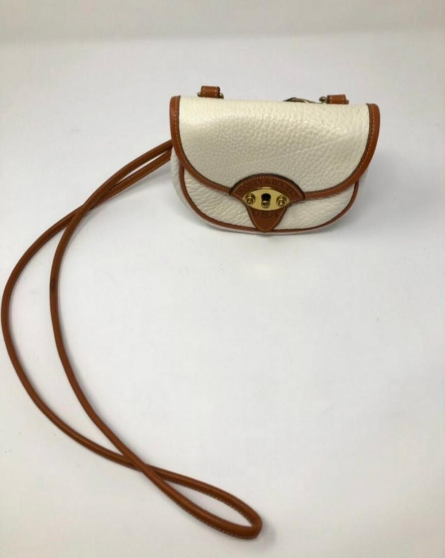 Dooney and bourke, Beige with a brown border: Dooney and bourke, Beige with a brown border