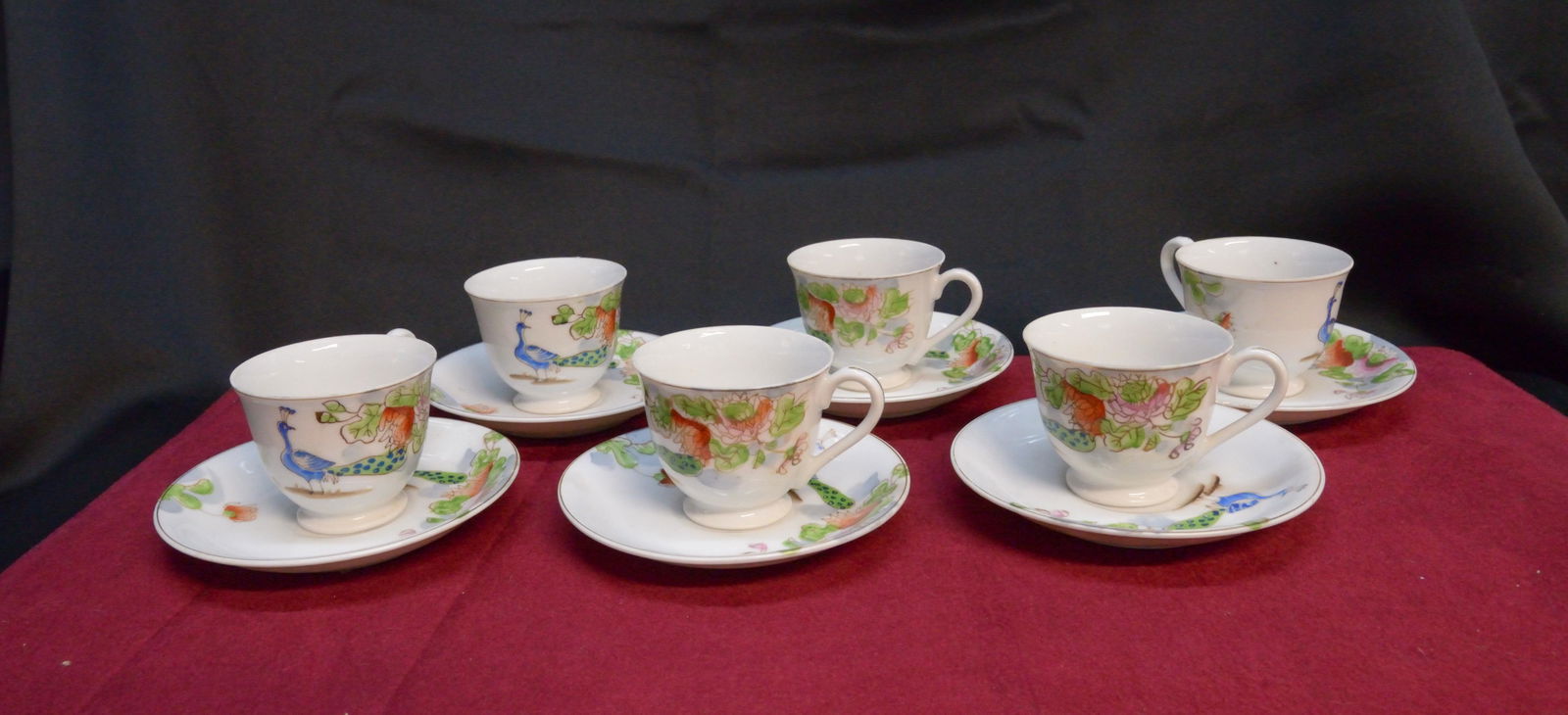 Set of six hand painted Japanese tea cups and saucers: Set of six hand painted Japanese tea cups and saucers with peacock motif