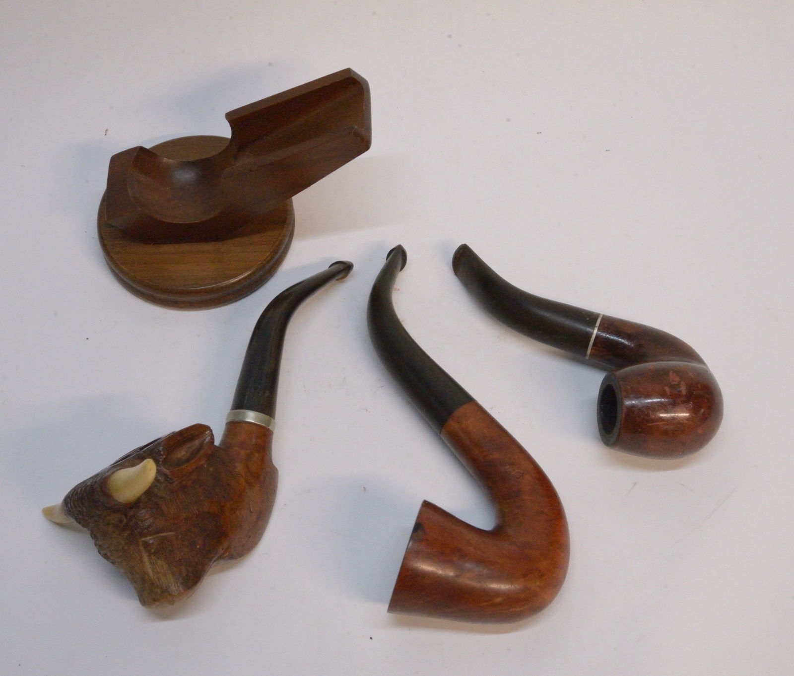 Pipe stand and three pipes, including carved buffalo: Pipe stand and three pipes, including carved buffalo head with carved bone(?) horns.