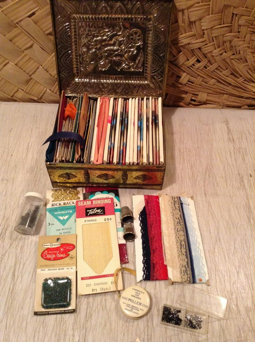Vintage Tin full of Seam binding, lace thimbles and: Vintage Tin full of Seam binding, lace thimbles and Haas Miller Chemical Measuring tape