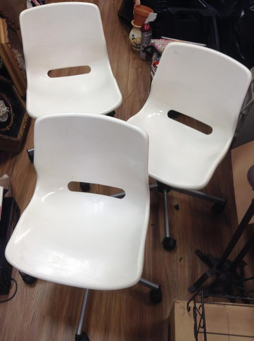 3 white plastic chairs with wheels (1 of 1)