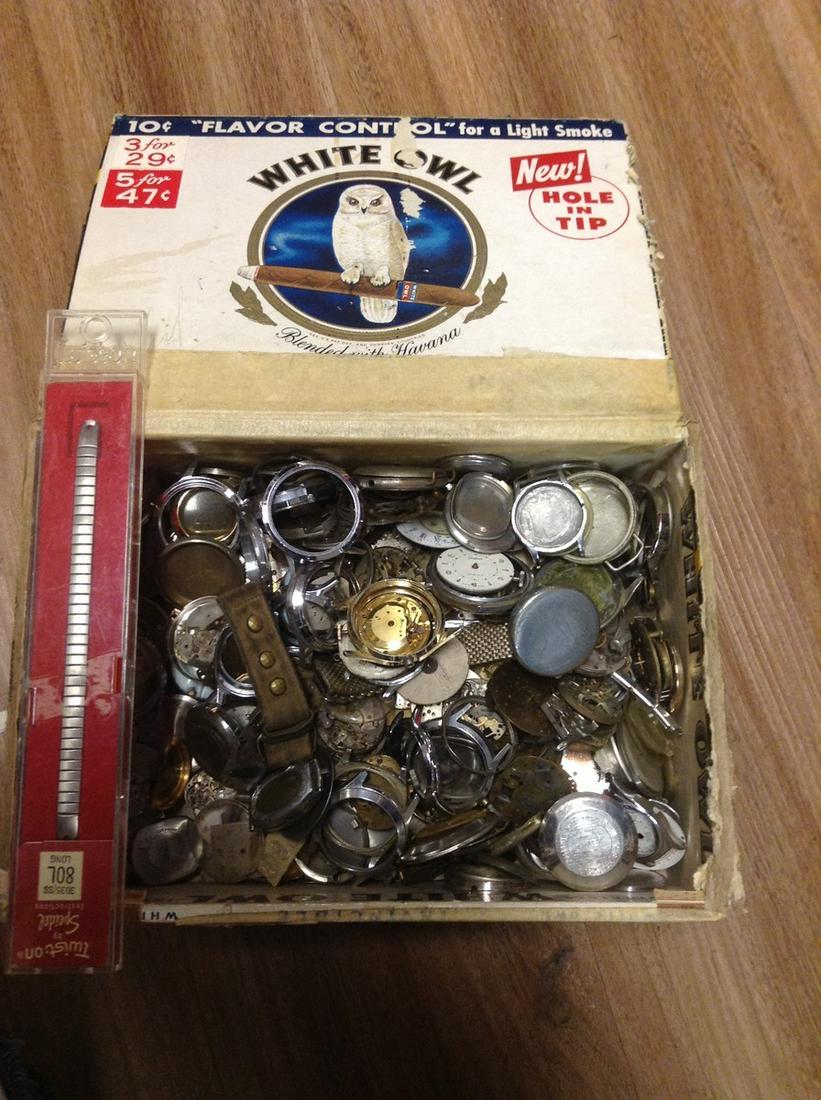 Cigar box full of watch parts: Cigar box full of watch parts
