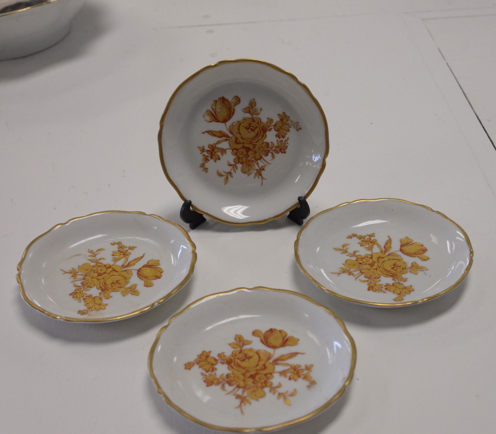 Set of 4 small gold rimmed Limoges plates: Set of 4 small gold rimmed Limoges plates