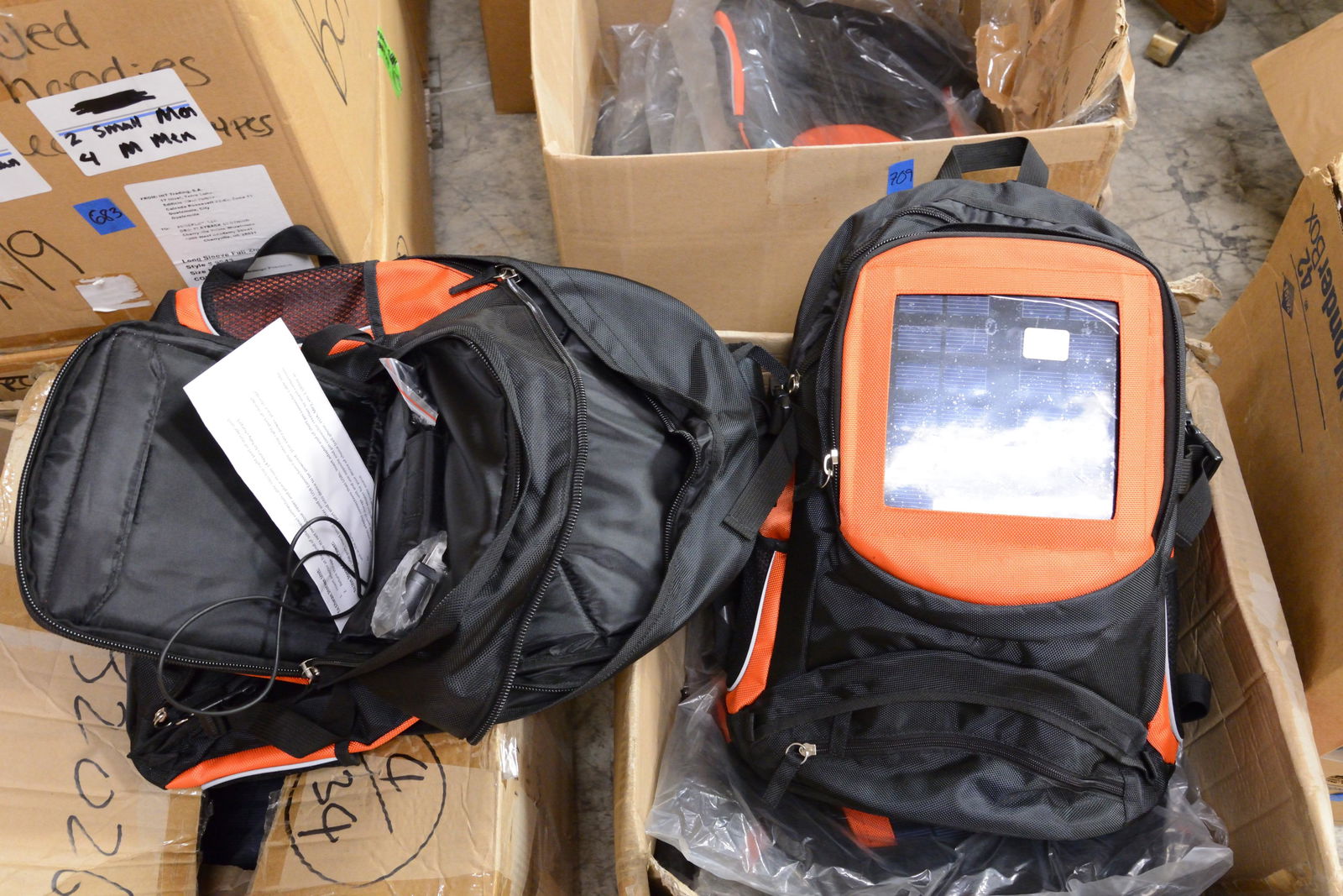 6 Orange and Black Solar Backpacks (1 of 1)