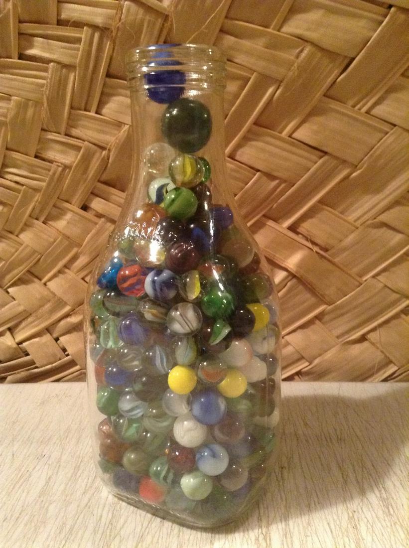 Milk Bottle Full of early Marbles 9" tall (1 of 1)