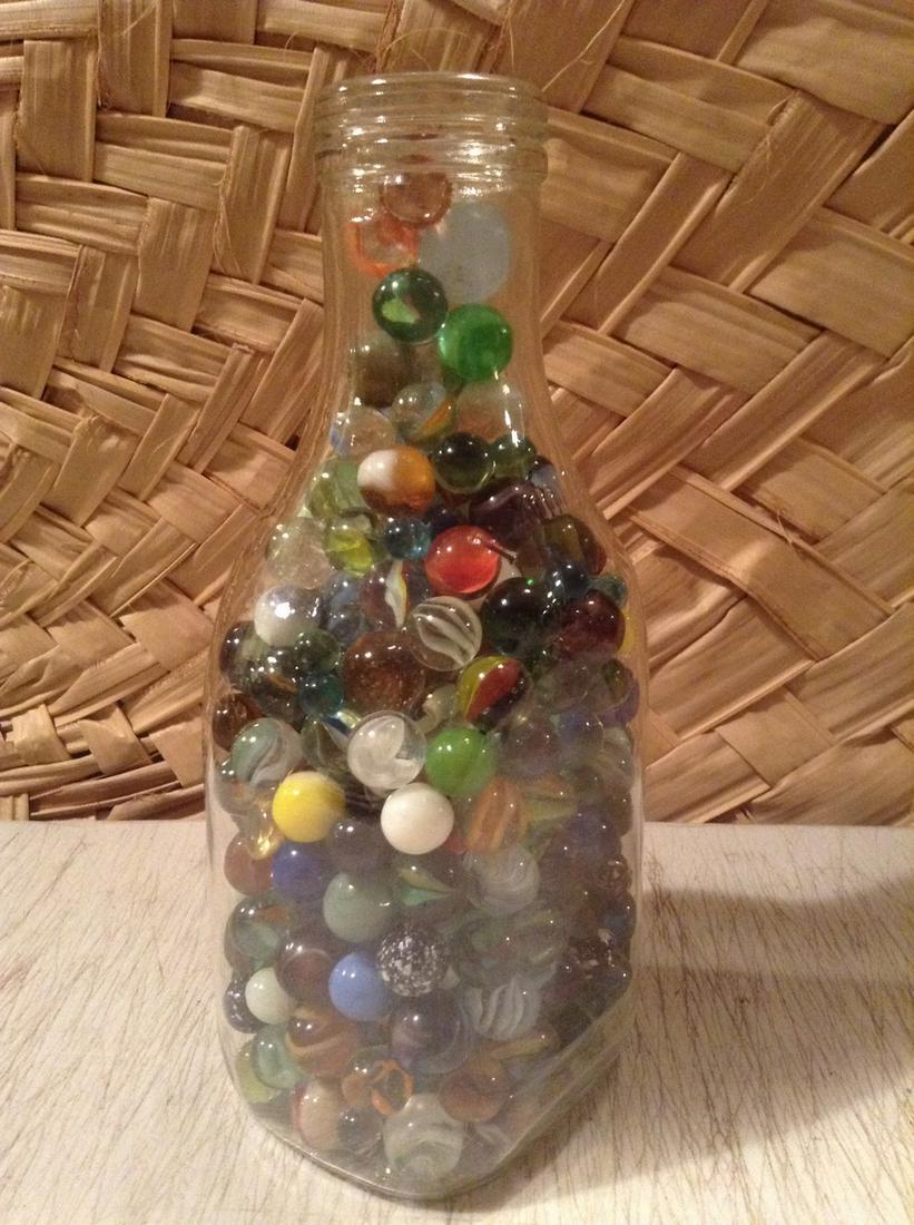 Milk Bottle Full of early Marbles 9" tall (1 of 1)