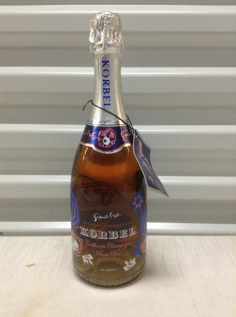 Sealed Frank Sinatra Korbel Rose Champagne 750ml: Any contents in bottle is Free; You are bidding on the bottle & unbroken tax stamp
