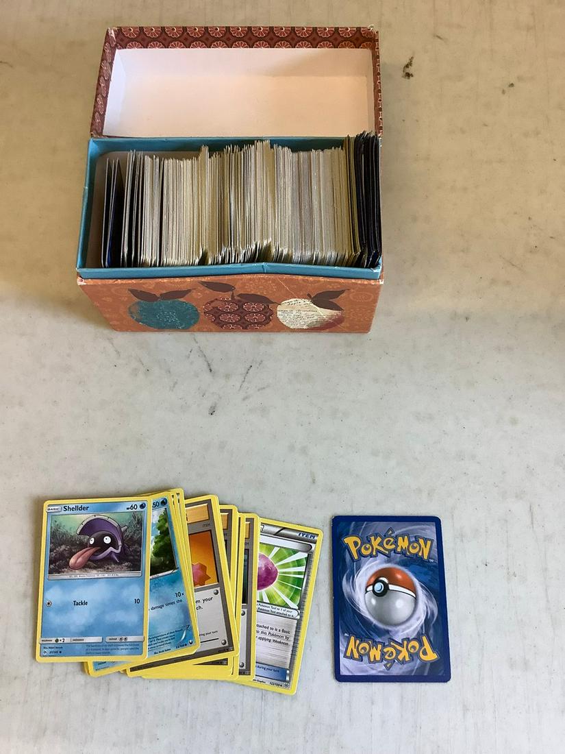 Large lot of pokemon cards in container: Large lot of pokemon cards in container