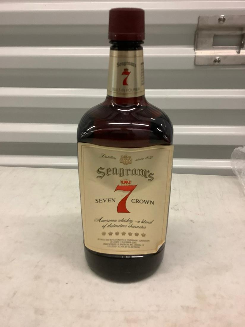 Segram's Seven Crown American Whiskey 1.75 liter bottle: Any contents in bottle is Free; You are bidding on the bottle & unbroken tax stamp
