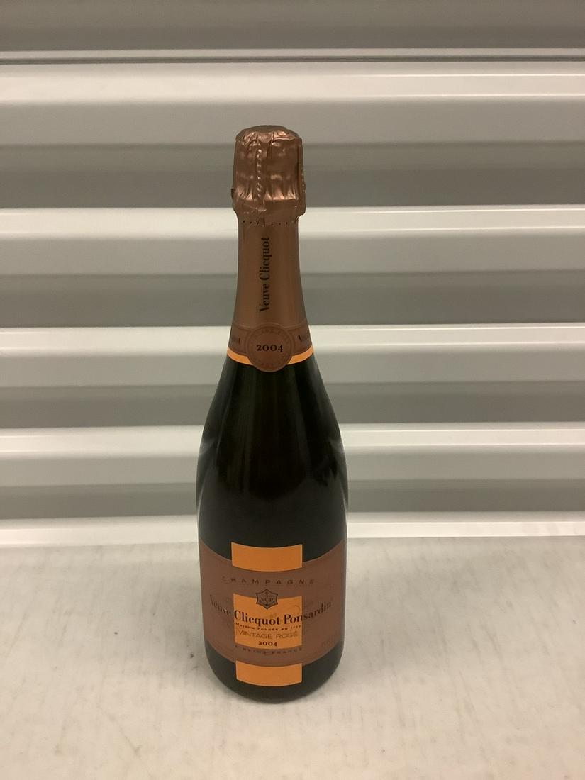 2004 Veuve Clicquot Ponsardin Vintage Rose 750 ML: Any contents in bottle is Free; You are bidding on the bottle & unbroken tax stamp