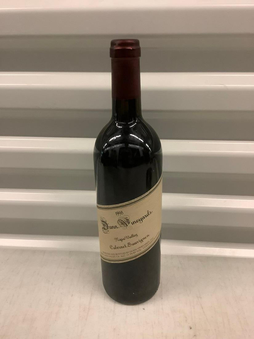 1998 Dunn Vineyards Cabernet Souvignon Full Bottle: Any contents in bottle is Free; You are bidding on the bottle & unbroken tax stamp
