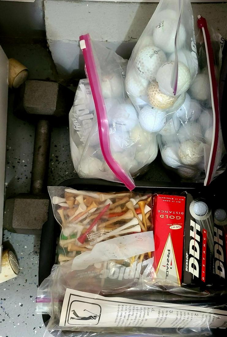 golf balls tees and barbell (1 of 1)