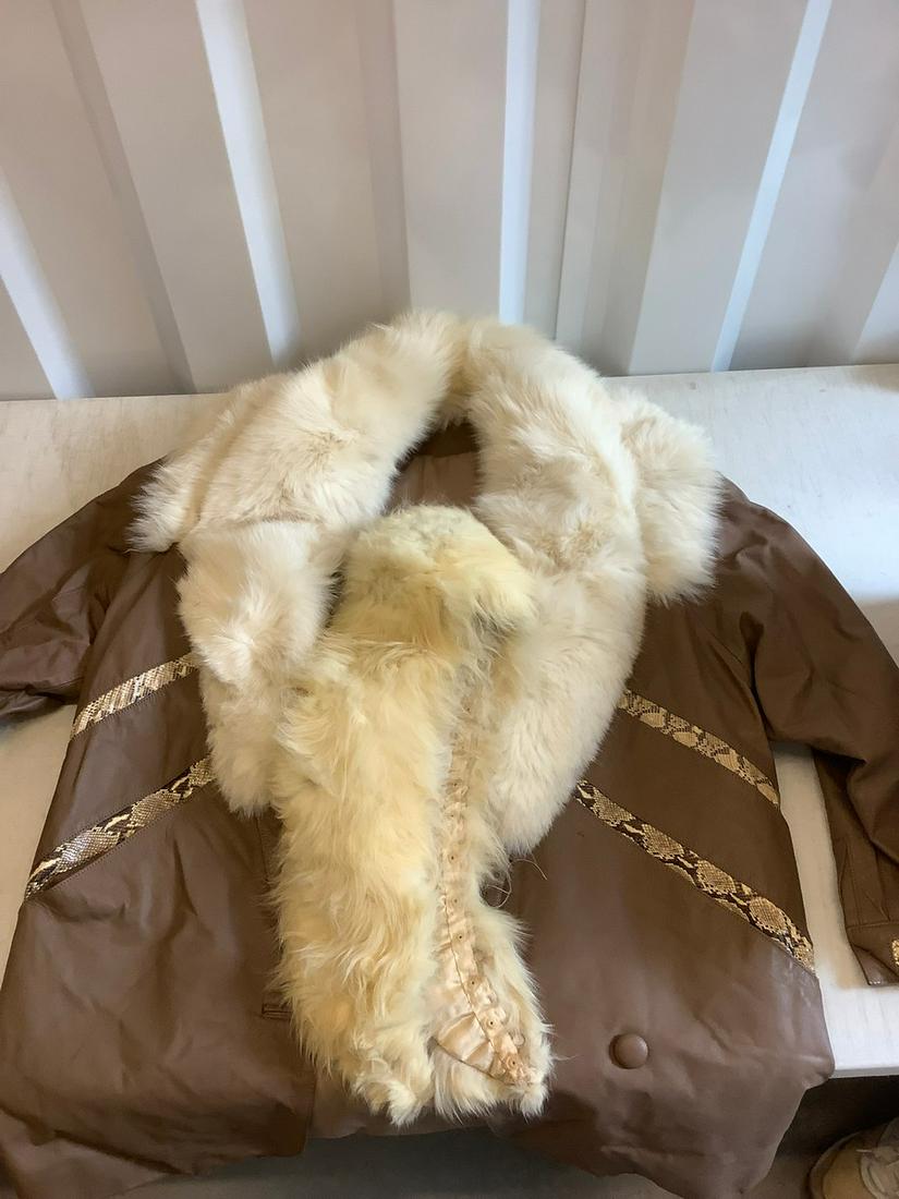 Fur, snakeskin, and leather jacket: Fur, snakeskin, and leather jacket
