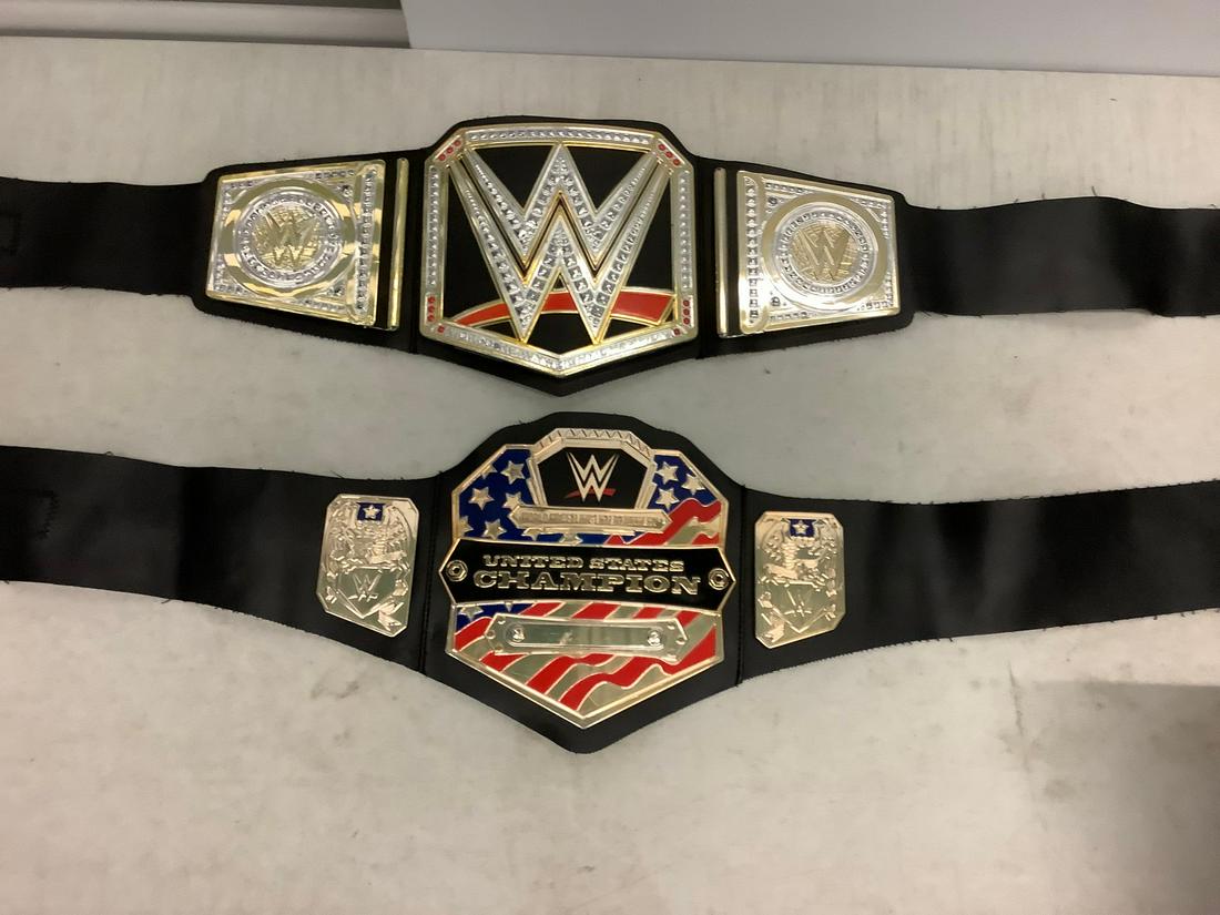 pair of WWE plastic belts: pair of WWE plastic belts