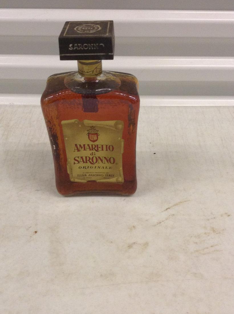 Disaronno 750mL bottle: Any contents in bottle is Free; You are bidding on the bottle & unbroken tax stamp