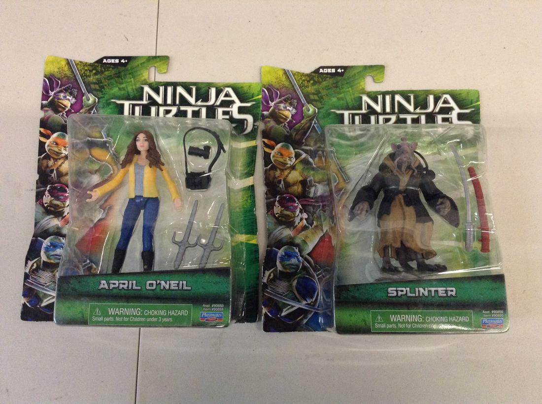 pair of teenage mutant ninja turtles figures (1 of 1)