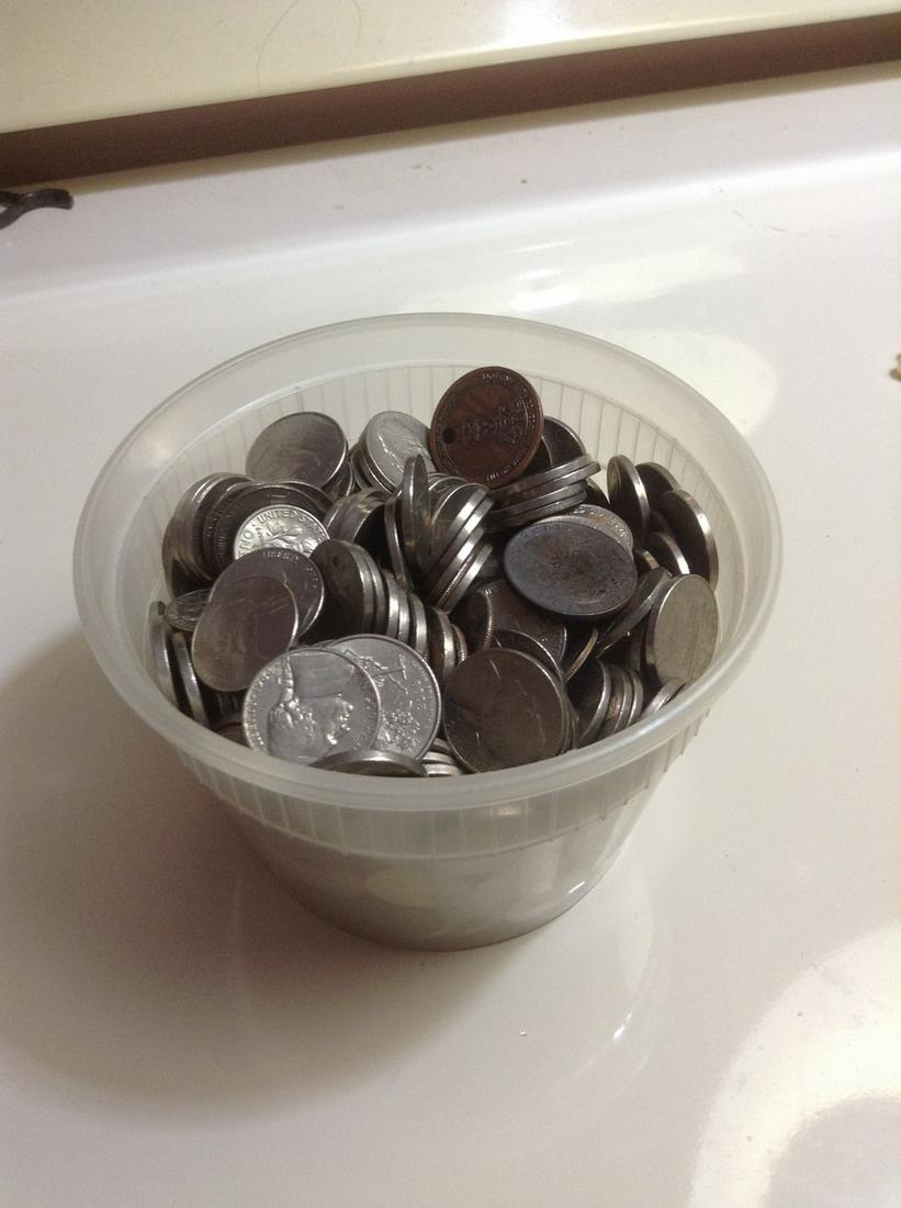 Container full of unsearched coins: Container full of unsearched coins