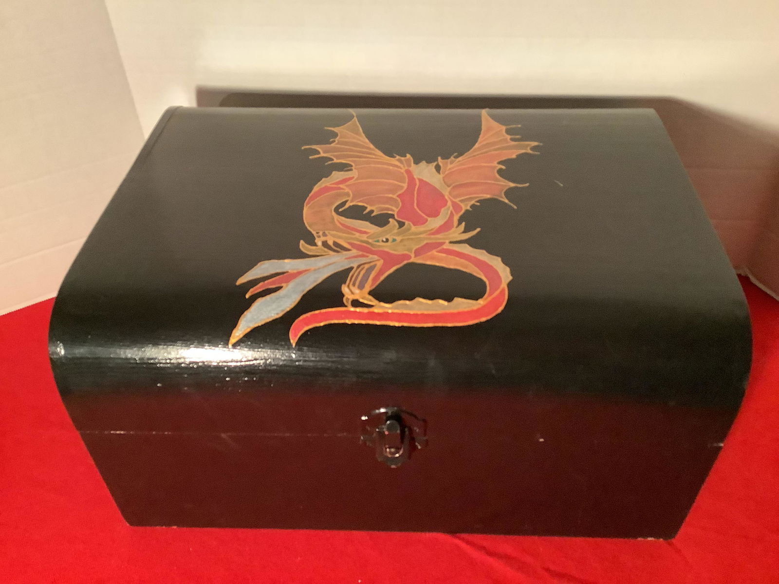 Medium Chest black w Dragon painted on it. Inside is (1 of 1)