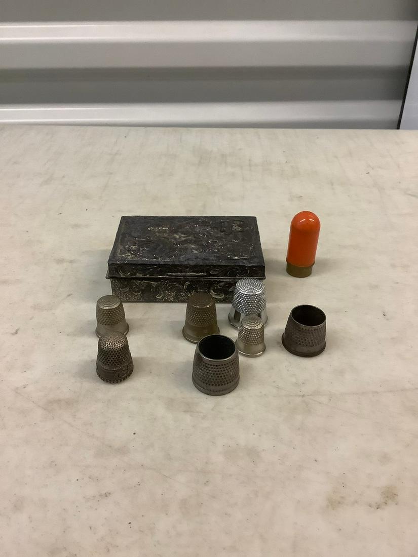 metal trinket box full of thimbles: metal trinket box full of thimbles