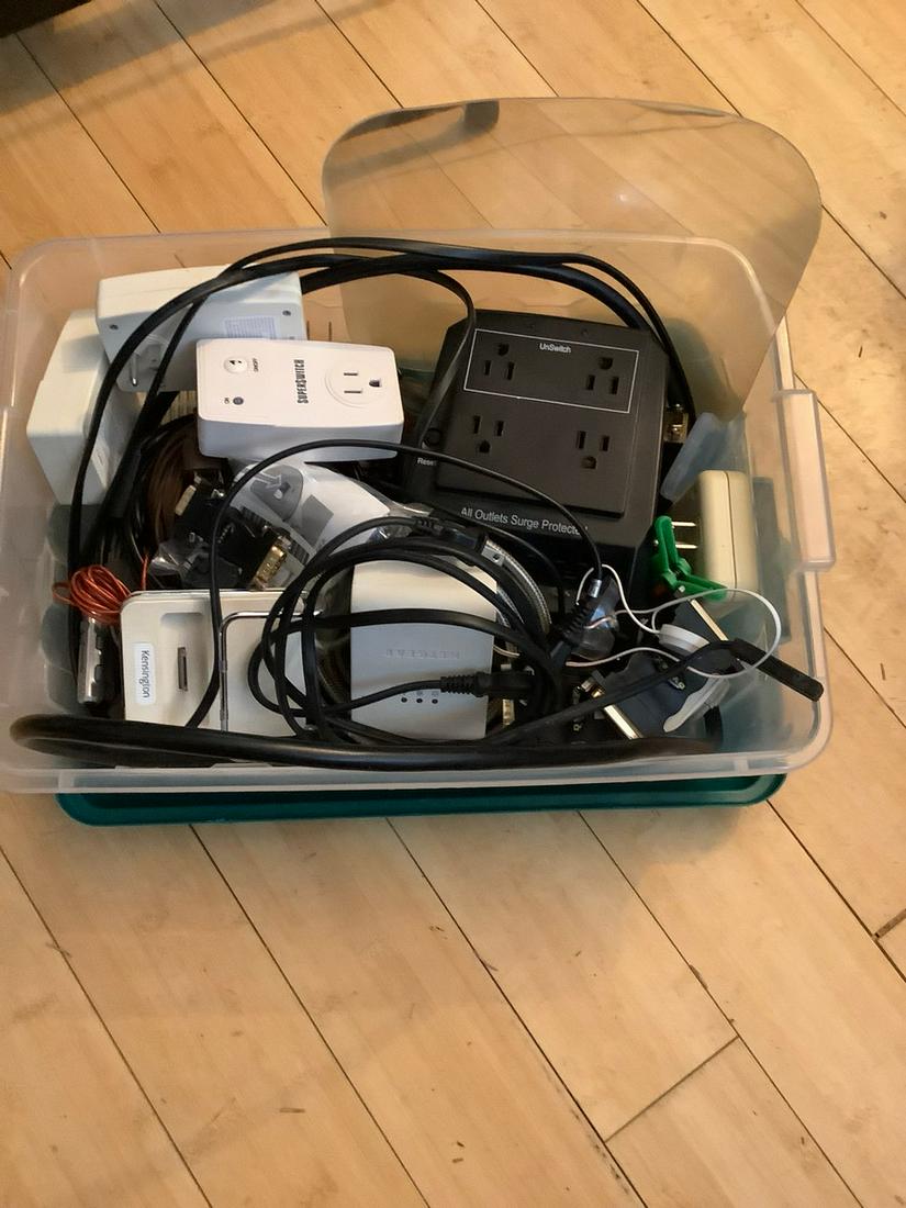 Large bin of surge protectors, outlets, misc wires and (1 of 1)