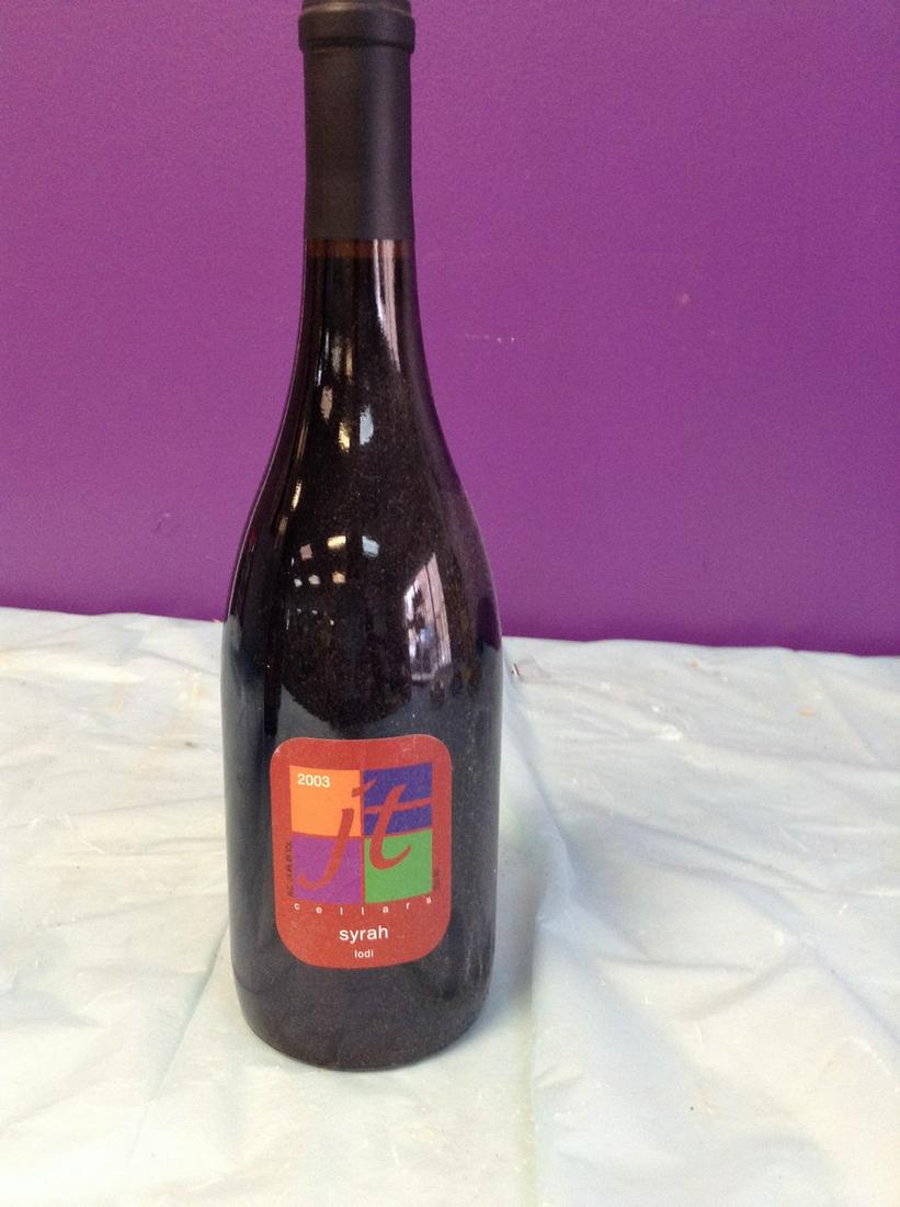 2003 JT Cellars Syrah 750 ML: Any contents in bottle is Free; You are bidding on the bottle & unbroken tax stamp