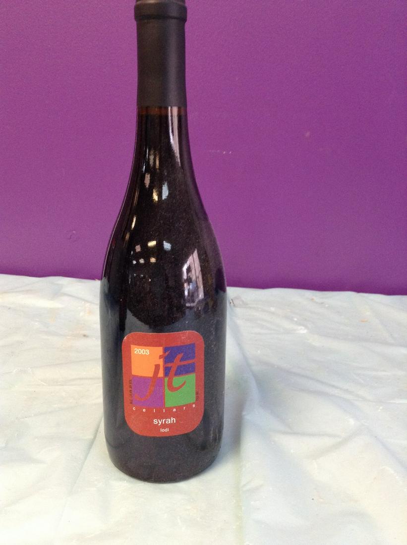 2003 JT Cellars Syrah 750 ML: Any contents in bottle is Free; You are bidding on the bottle & unbroken tax stamp