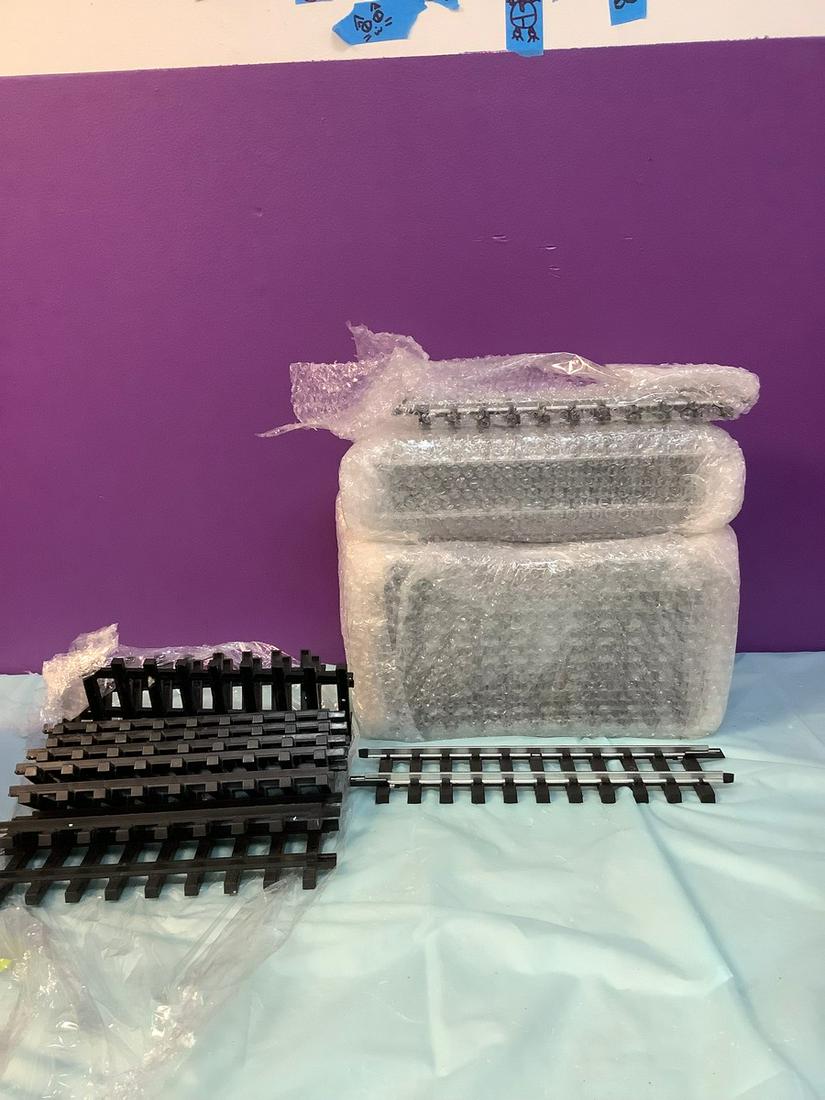 Box full of model train tracks (1 of 1)