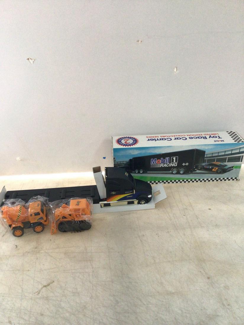 mobil toy race car carrier and 2002 special edition sunoco truck: mobil toy race car carrier and 2002 special edition sunoco truck