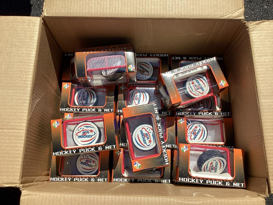 Box full of USA Hockey Commemorative Hockey Pucks & Nets in boxes: Box full of USA Hockey Commemorative Hockey Pucks & Nets in boxes