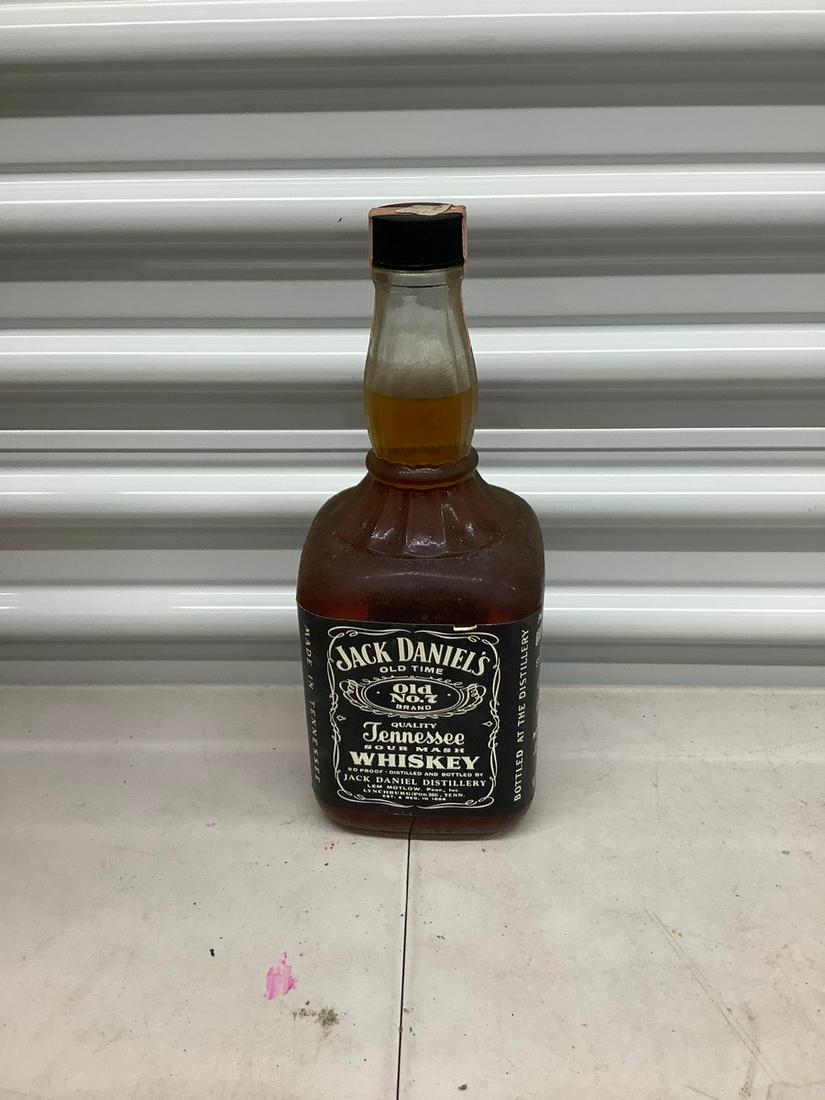 Jack Daniels sealed 1.75 liter bottle: Any contents in bottle is Free; You are bidding on the bottle & unbroken tax stamp