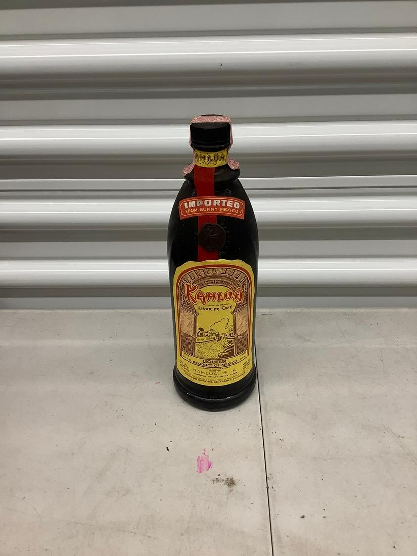 Kahlua 750 mL bottle with sealed tax stamp: Any contents in bottle is Free; You are bidding on the bottle & unbroken tax stamp