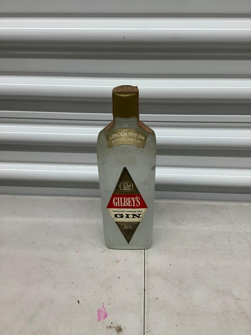 750 mL bottle of Gilbys Gin: Any contents in bottle is Free; You are bidding on the bottle & unbroken tax stamp