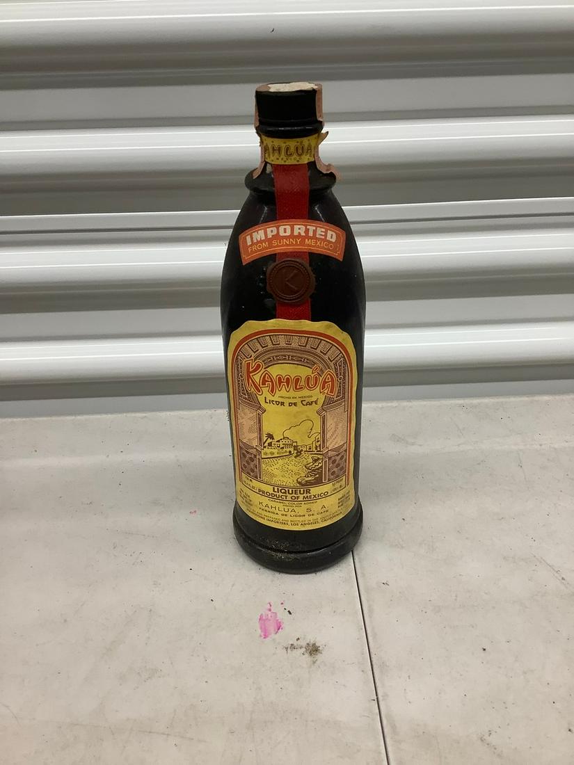 Kahlua 750 mL bottle with sealed tax stamp: Any contents in bottle is Free; You are bidding on the bottle & unbroken tax stamp