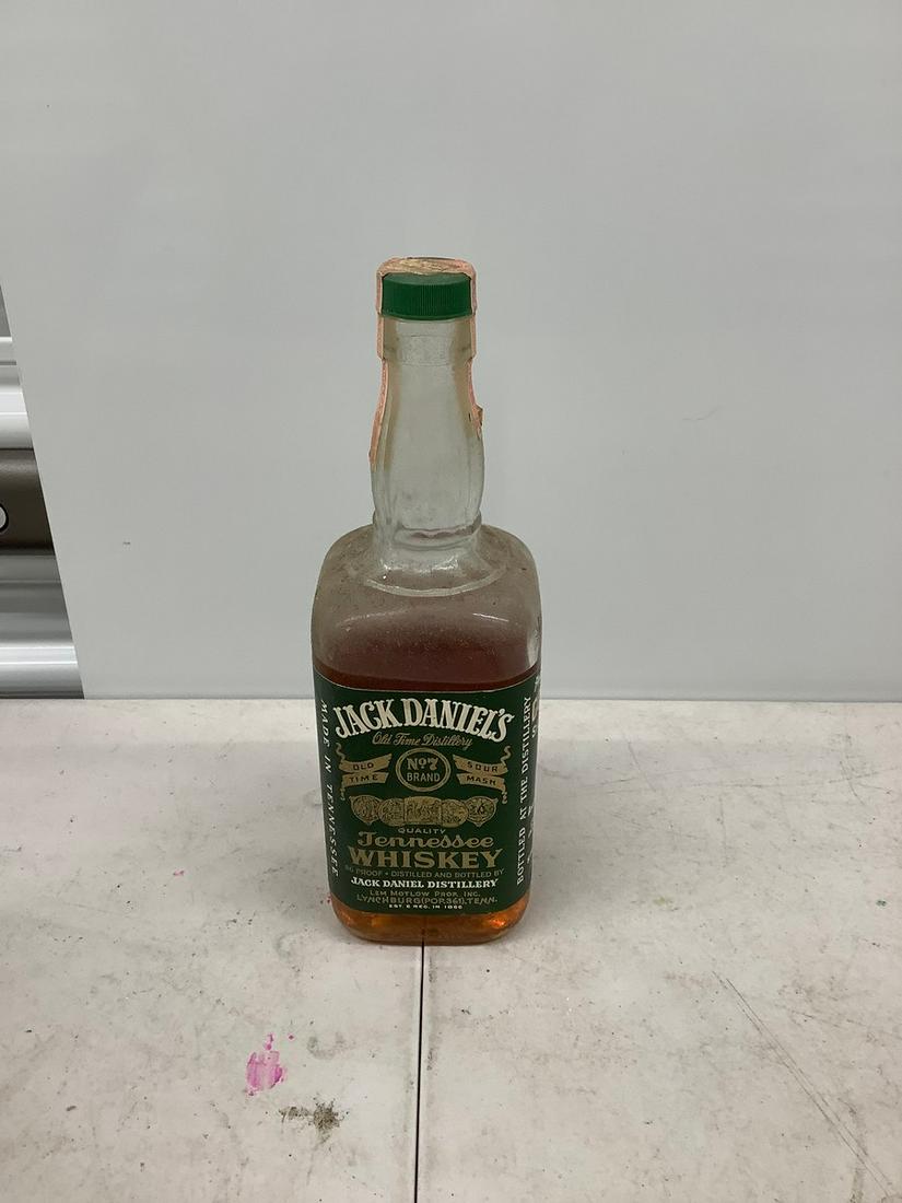 1 auart jack daniels green label with tax stamp 80% full bottle: Any contents in bottle is Free; You are bidding on the bottle & unbroken tax stamp